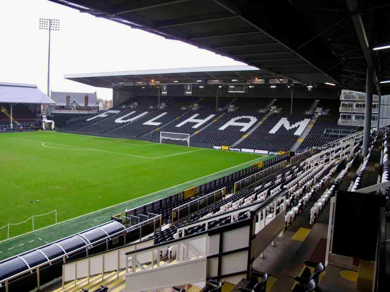 A stadium with many seats and people in it